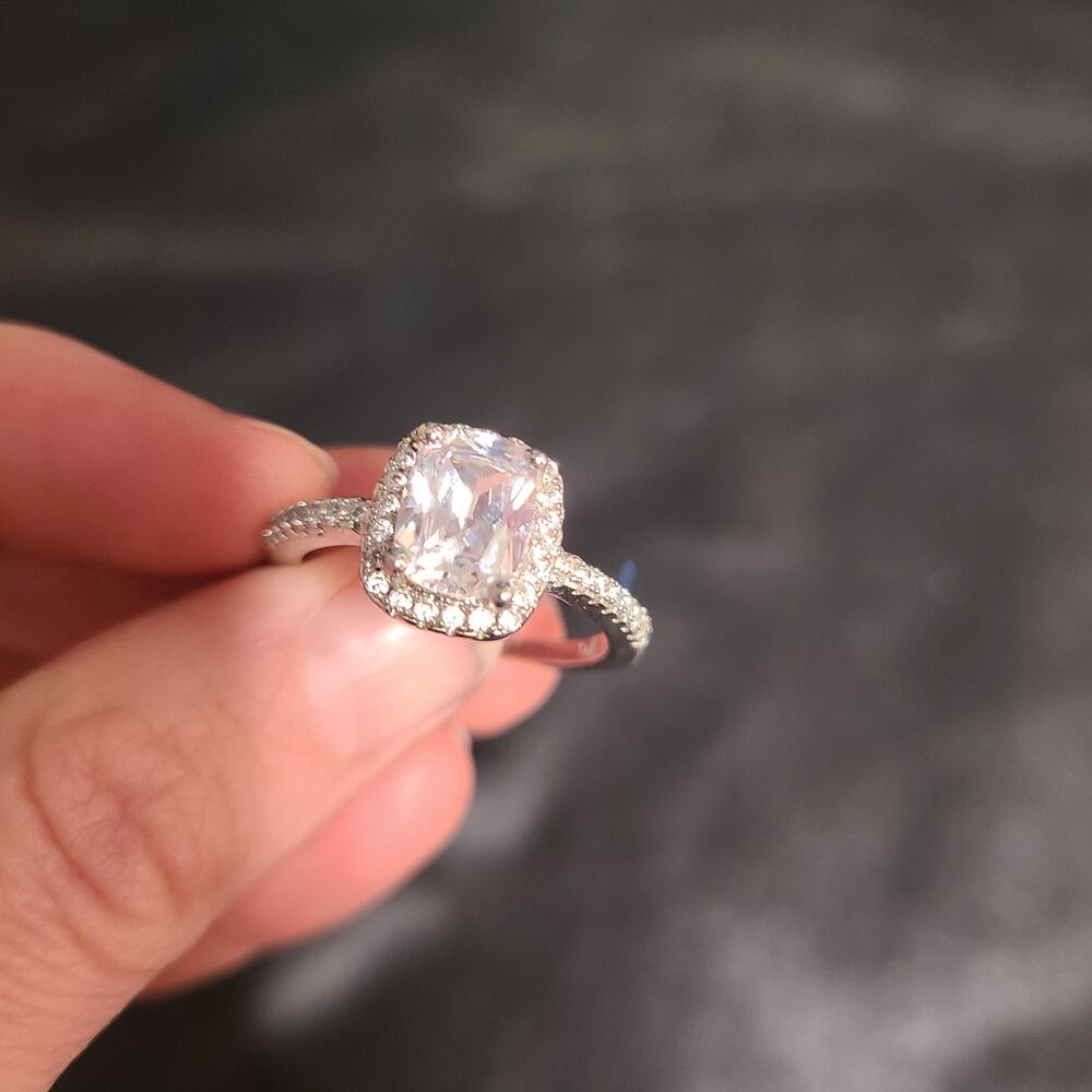Cushion cut center stone surrounded by pave halo ring size 10